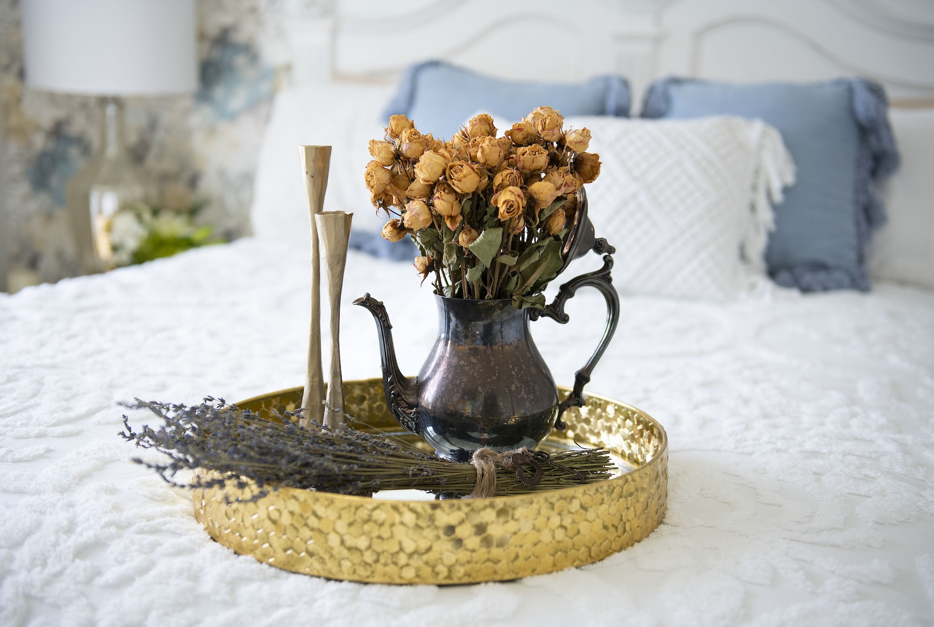 Gold Tray Sitting On White Bedspread